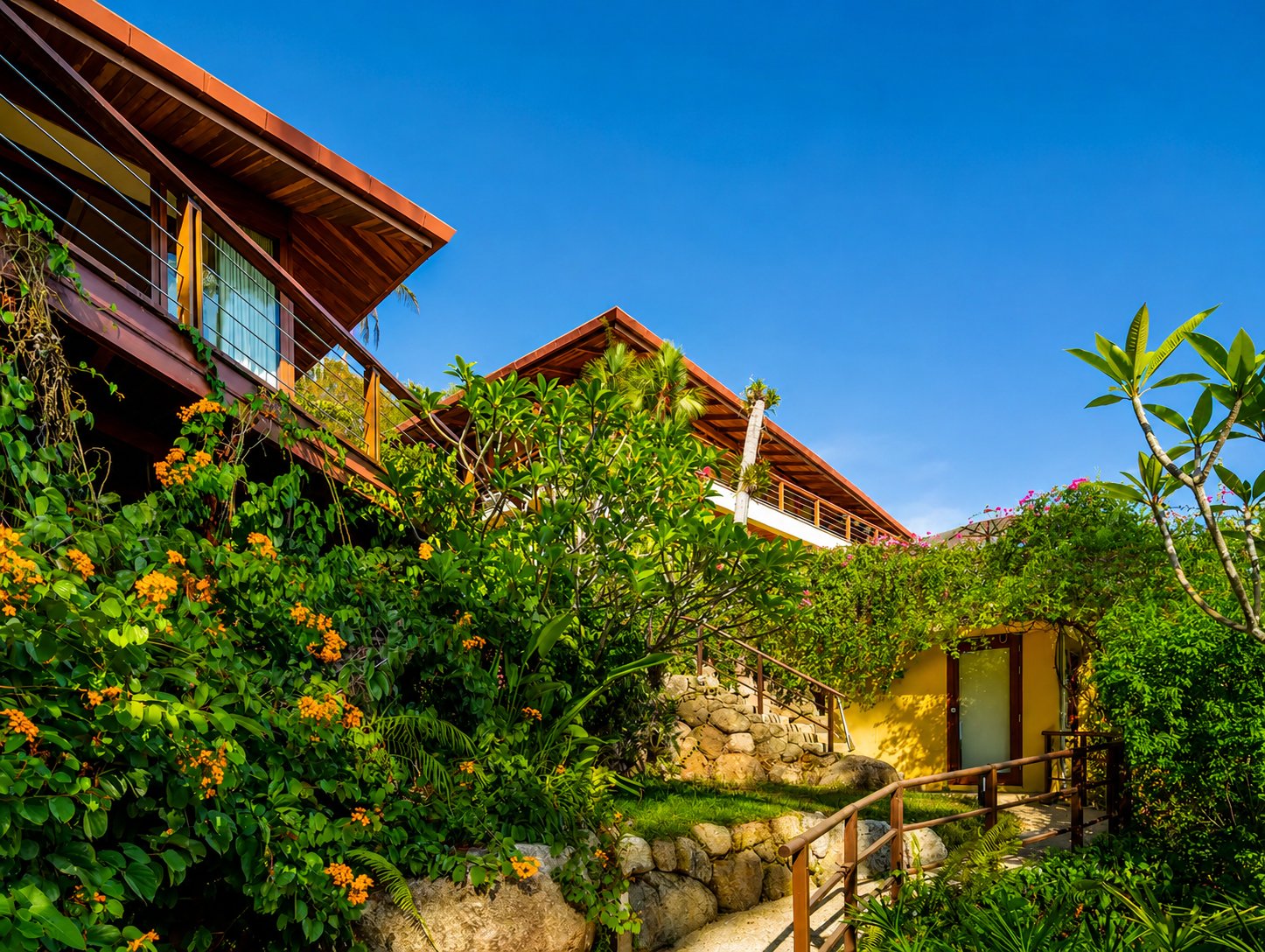 Hillside villa pavilions surrounded by tropical gardens