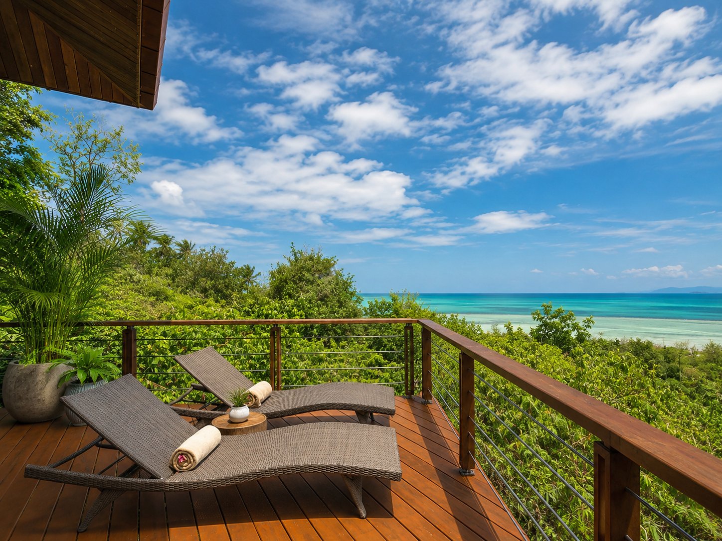 Private deck with sun loungers overlooking the sea